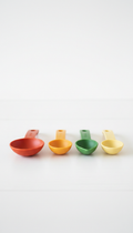 Measuring spoons set in fresh herb